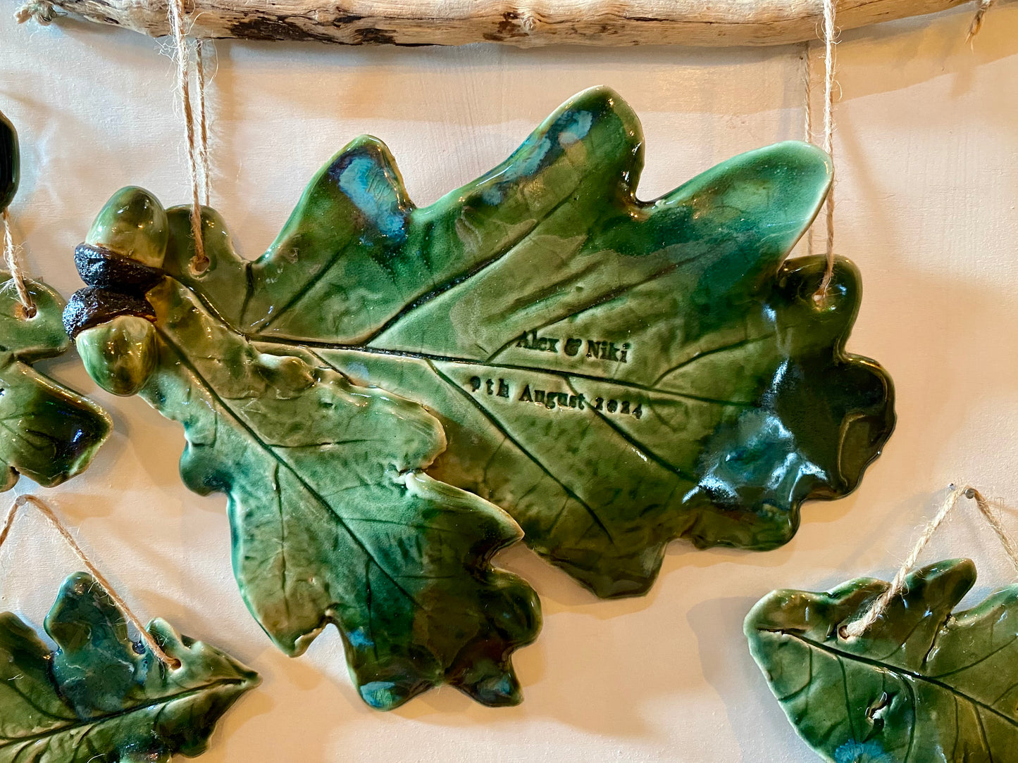 Double oak leaf sculpture for hanging on a wall, christmas tree or a personalised place setting.
